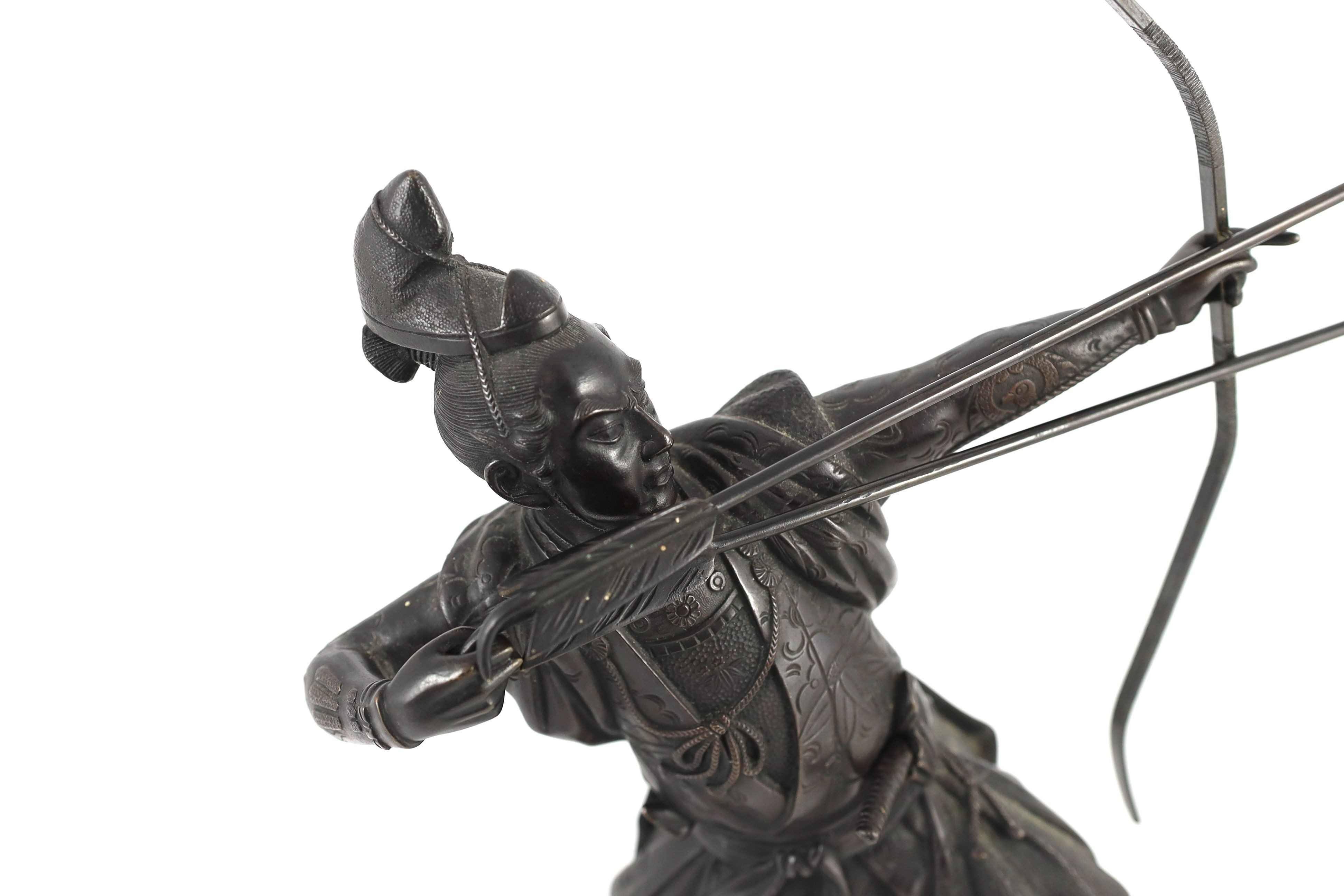 A Japanese bronze figure of a kneeling archer, Meiji period, 40 cm high